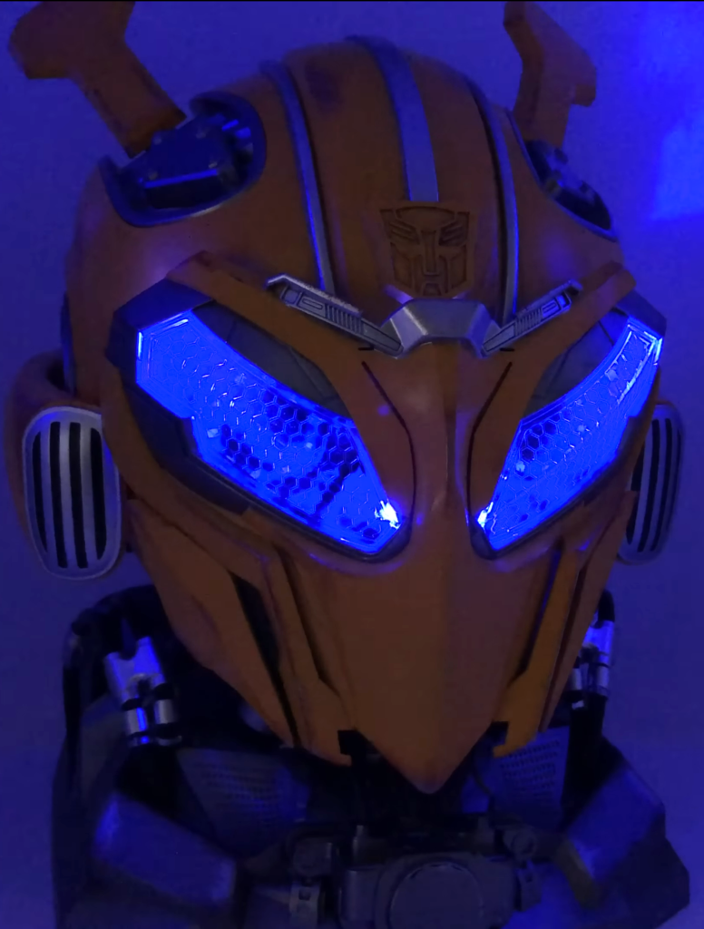 Close-up of the Bumblebee battle mask closed with the blue LEDs lit