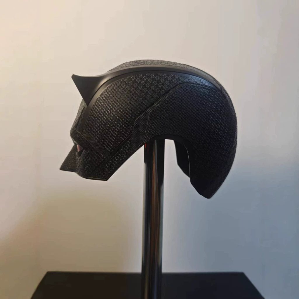 Side profile of the black Daredevil mask showing the woven suit texture