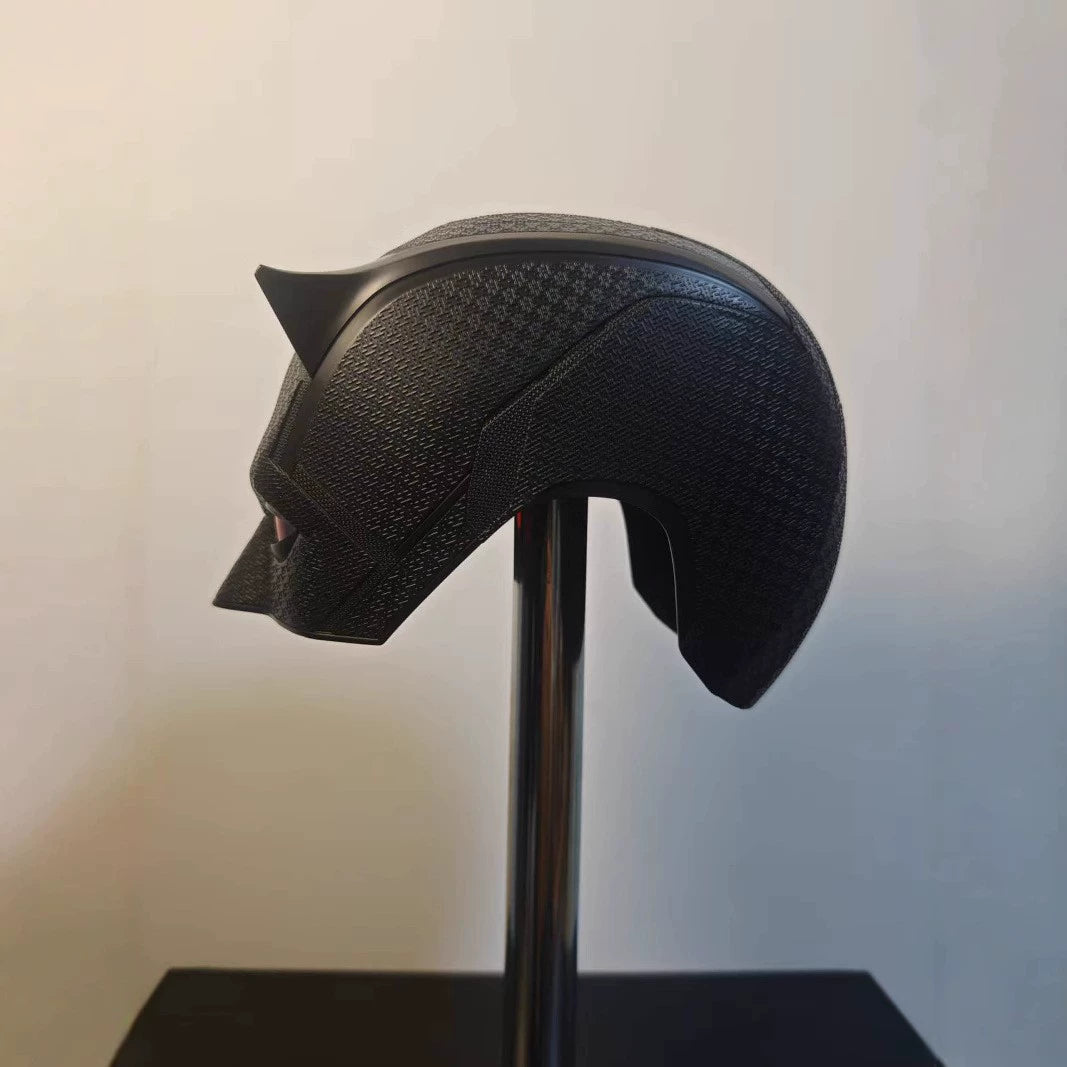 Side profile of the black Daredevil mask showing the woven suit texture