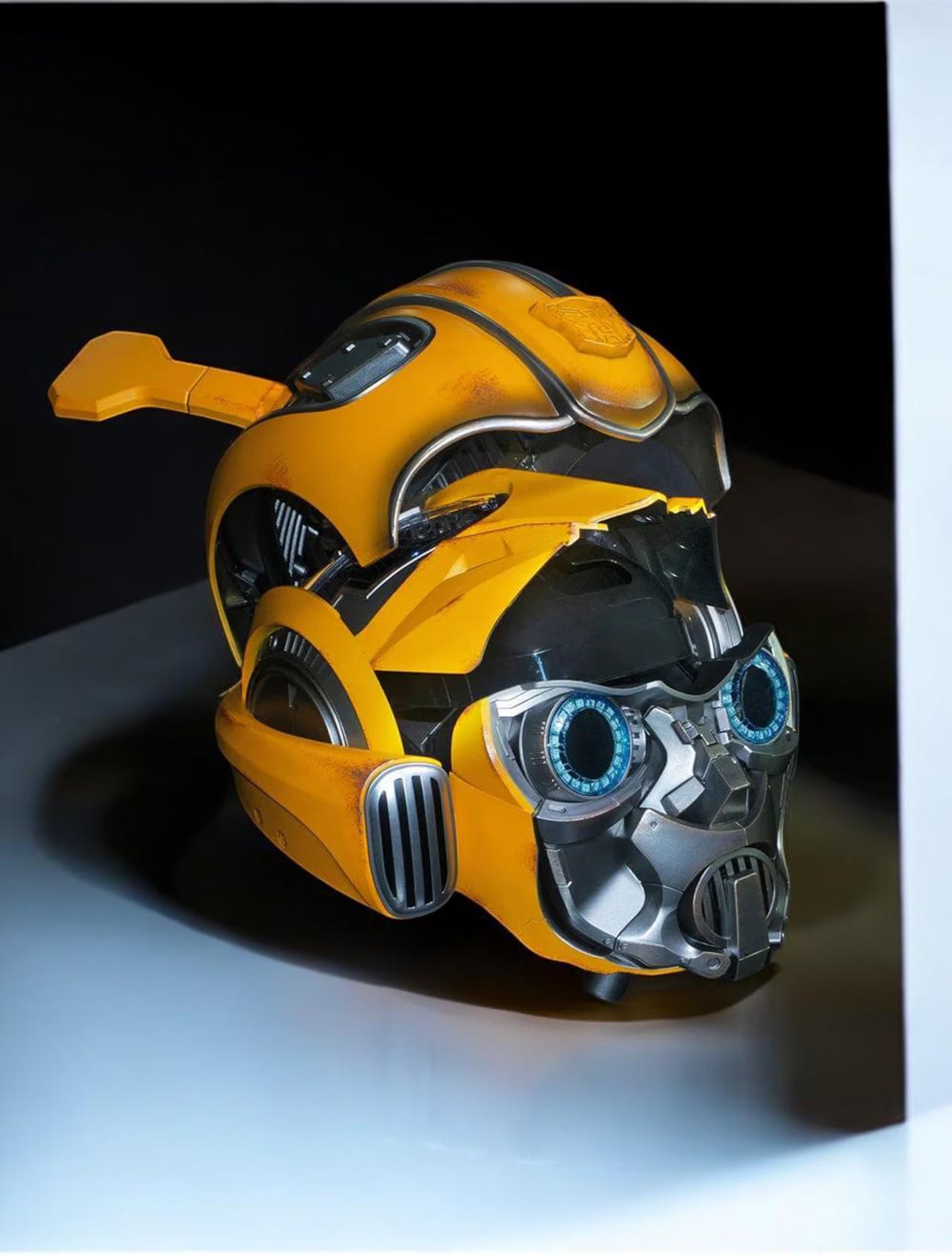 Side view of the Bumblebee helmet mid-transformation, inner mechanism visible