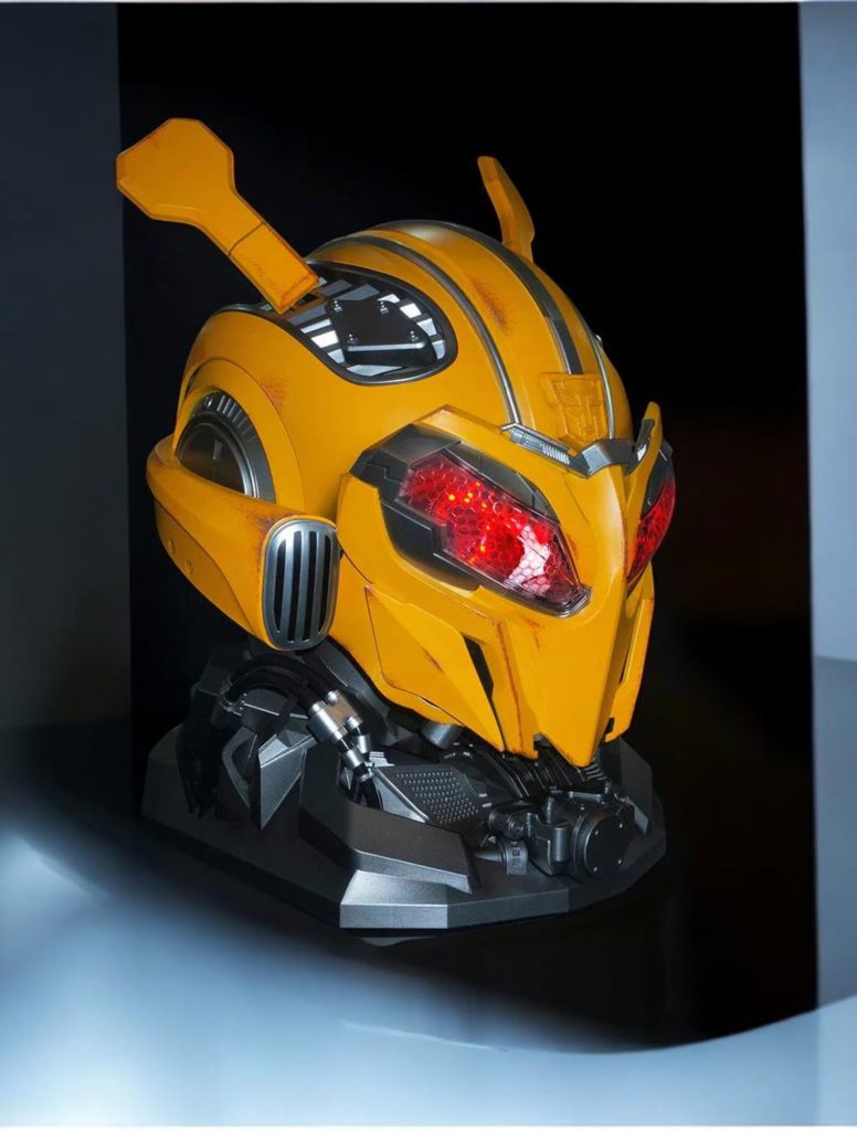 Bumblebee helmet with the faceplate closed and red LED eyes, three-quarter view